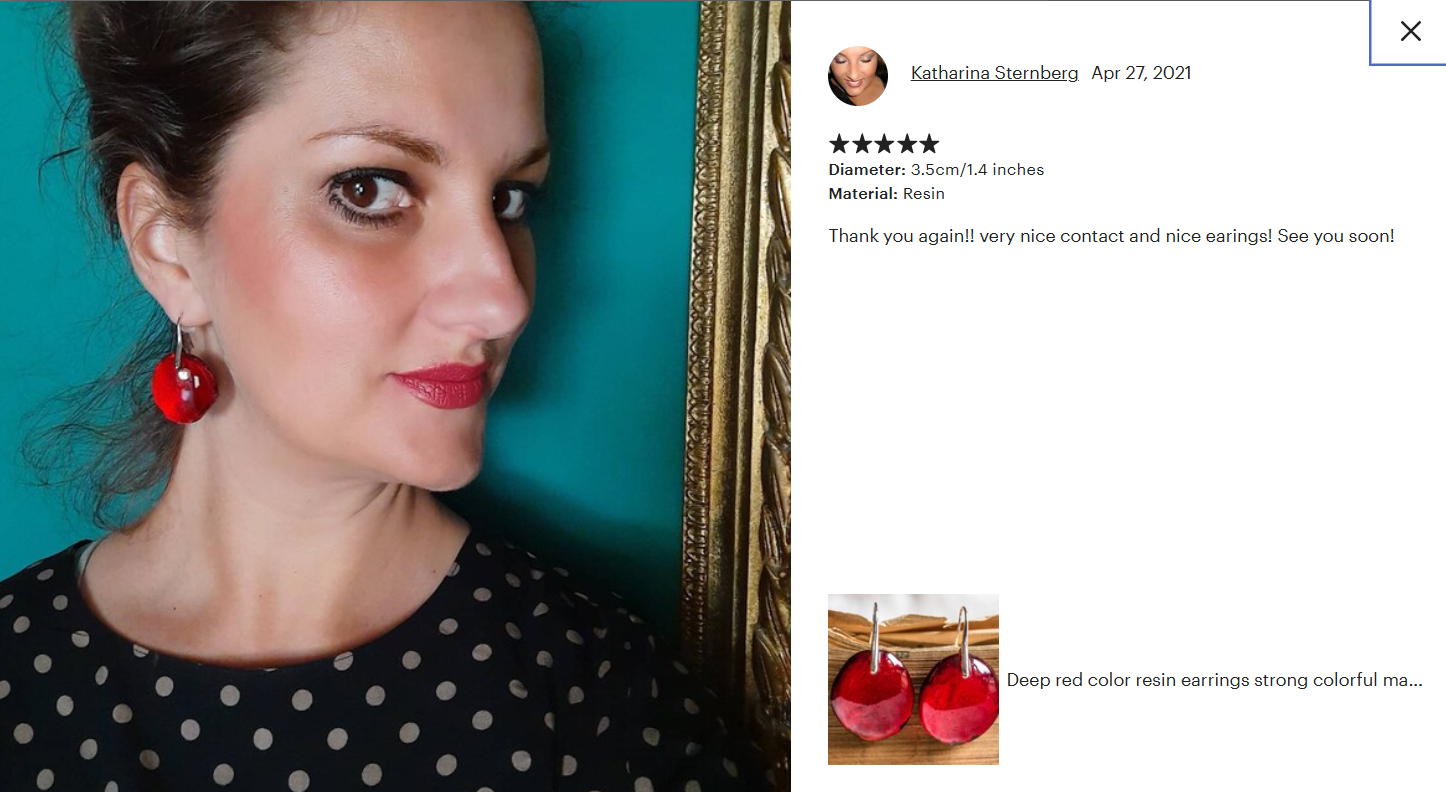 Original Etsy customer review with a photo: a customer wearing red earrings